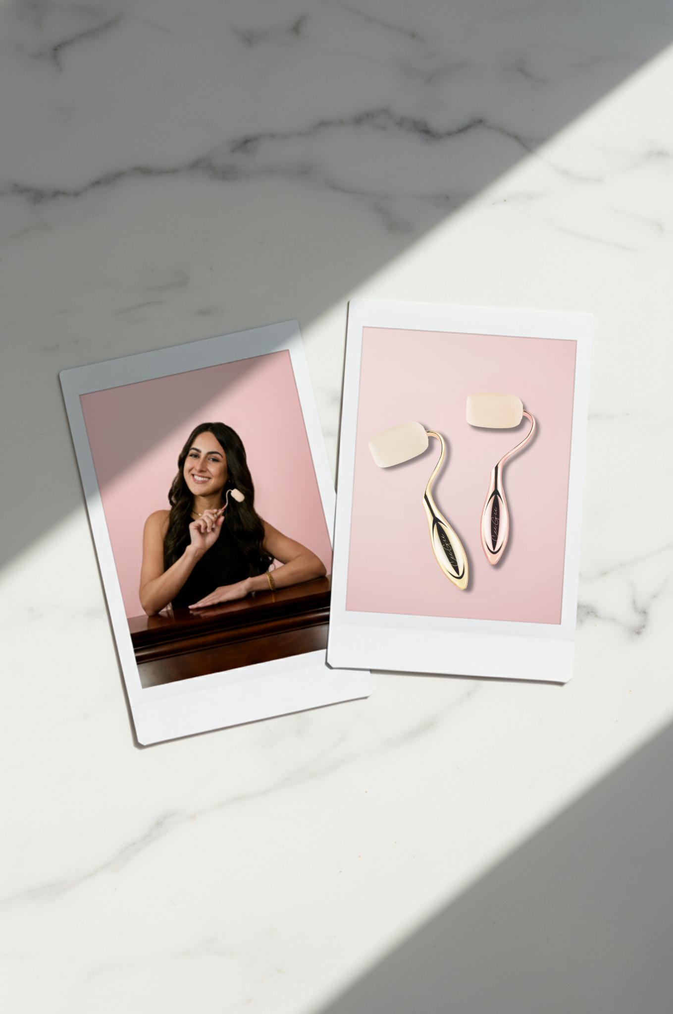 Two polaroid-style images on a marble surface, one with a woman and the other with beauty tools.