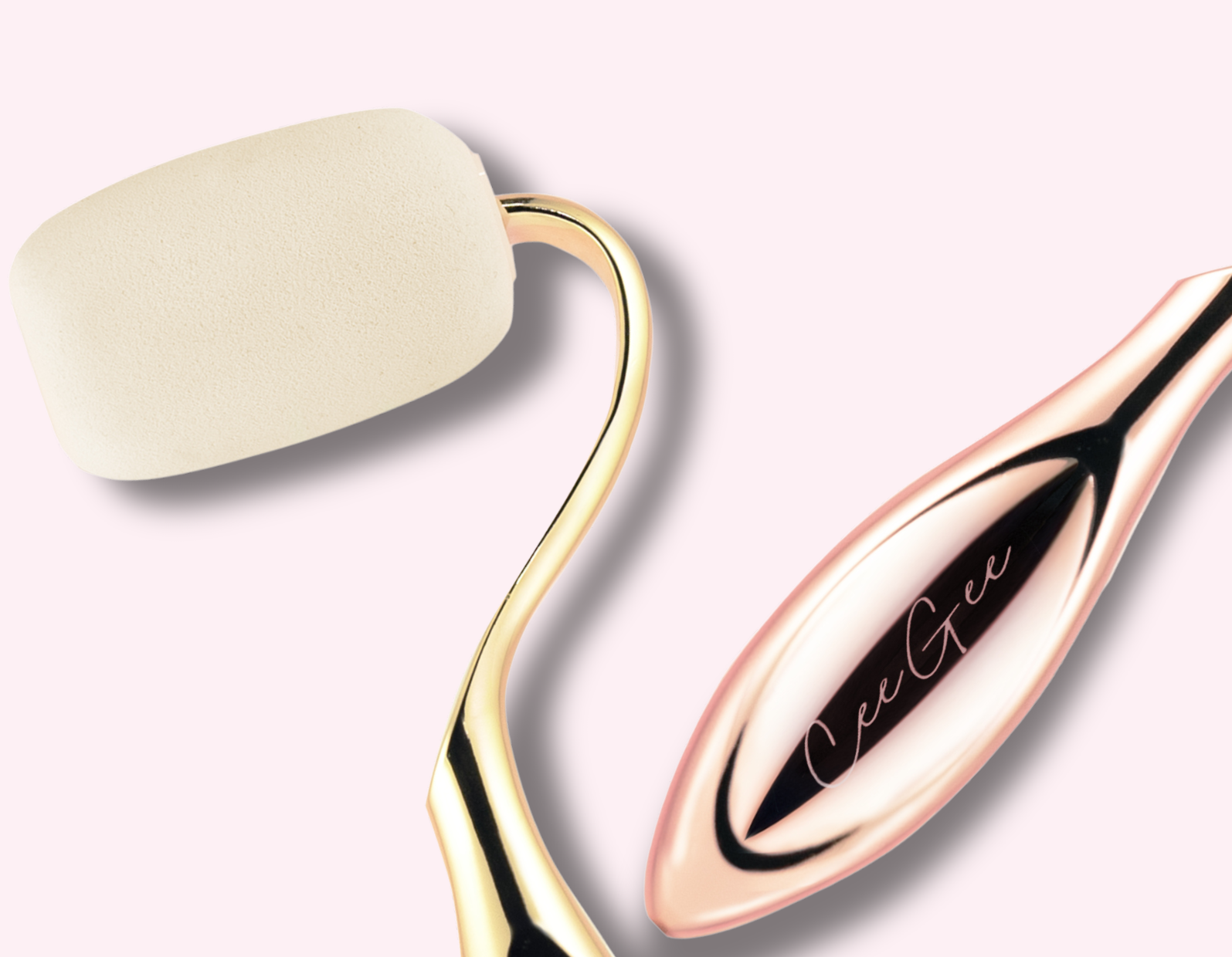 Two beauty tools, one gold and one rose gold, on a light background.