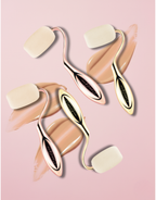Beauty tool with cream samples on a pink background