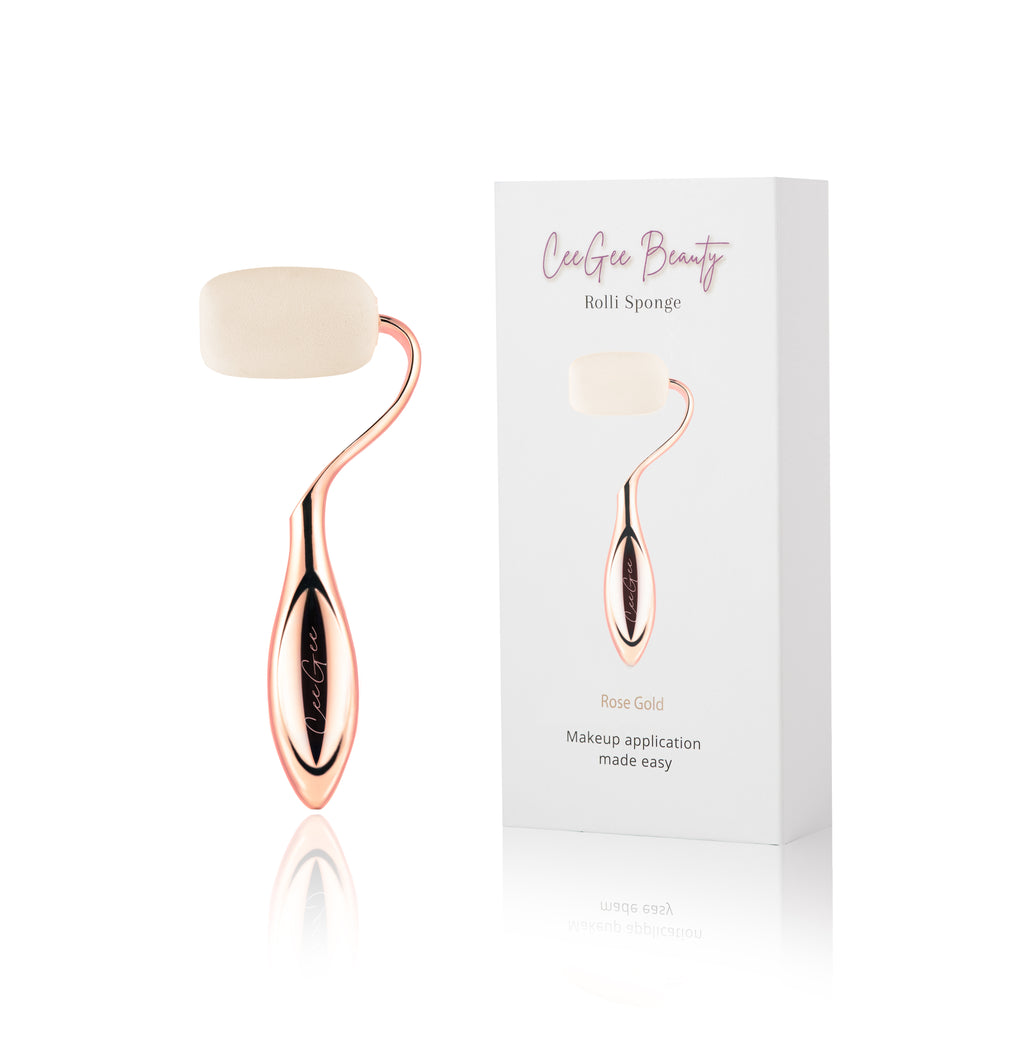 Rose gold roller with white roller and packaging on a white background