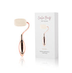 Rose gold roller with white roller and packaging on a white background
